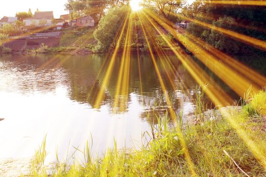 Magic pond. Composition of a pond and rays. Natural background