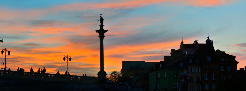 Sunset in Warsaw Old Town. Panoramic wide angle wiev.