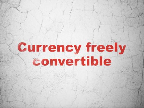 Money concept: Red Currency freely Convertible on textured concrete wall background