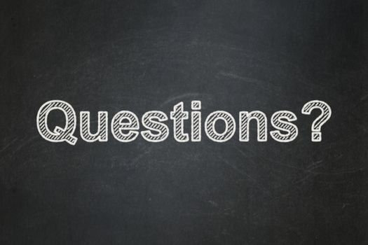 Learning concept: text Questions? on Black chalkboard background