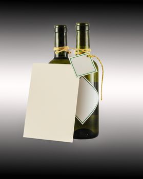 two bottles of wine with greeting card on the black background