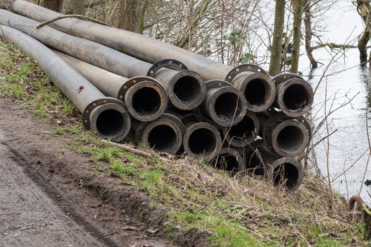 Pipeline, plastic pipes float on the water surface.