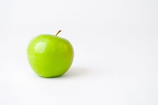 Green apple isolated on white. Room for text