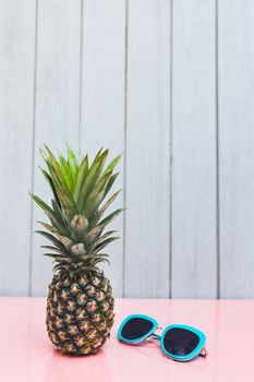 Pineapple on a blue pastel background .