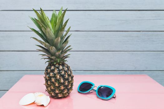 Pineapple on a blue pastel background .