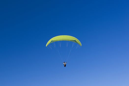 Paragliding sport in blue sky.