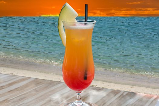 Colorful cocktail on the table of a bar in the restaurant in the background the blue sea.