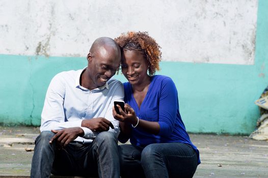 This couple is happy to discover and share new phone application.