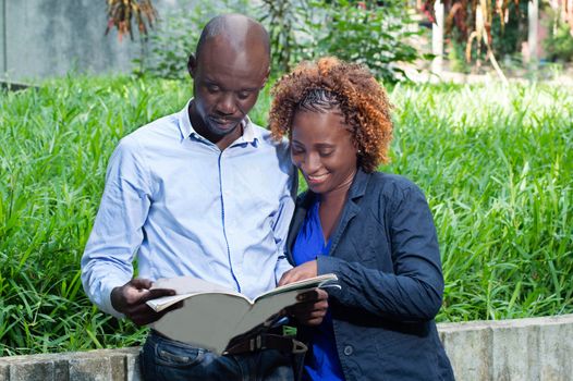 This young couple met in a park, converse about a magazine subject.