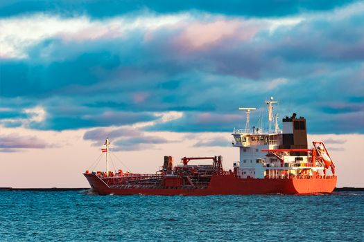 Red cargo oil tanker moving to Baltic sea