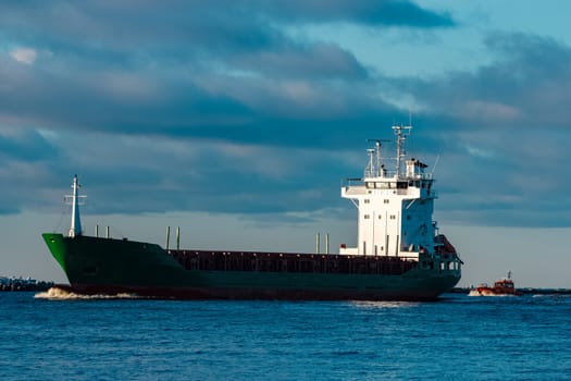 Green bulk carrier sailing from the Baltic sea