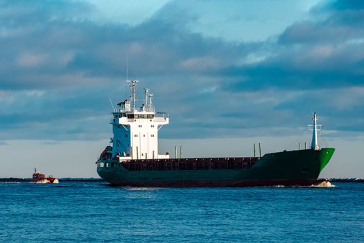 Green bulk carrier sailing from the Baltic sea
