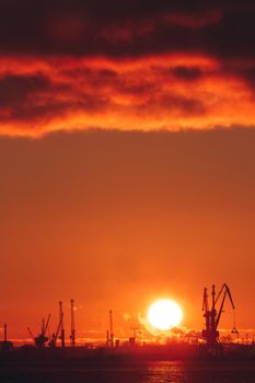 Hot winter sunrise over the cargo port in Riga