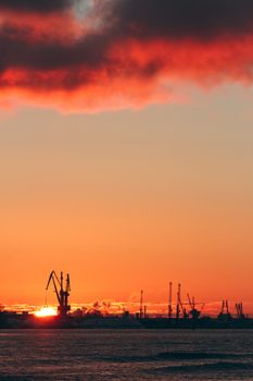 Hot winter sunrise over the cargo port in Riga