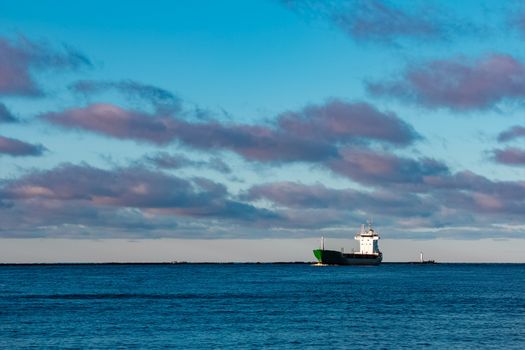 Green bulk carrier sailing from the Baltic sea