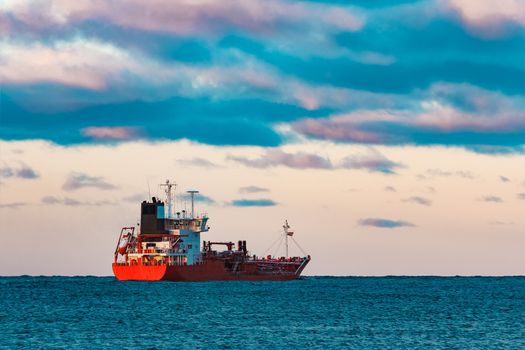 Red cargo oil tanker moving to Baltic sea