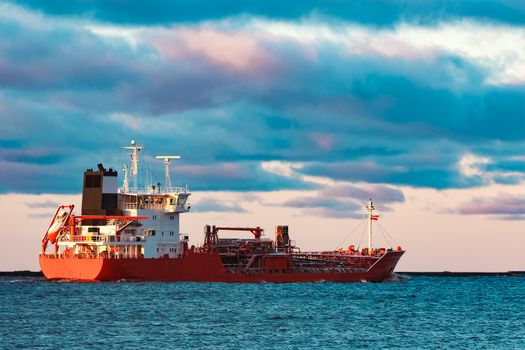 Red cargo oil tanker moving to Baltic sea