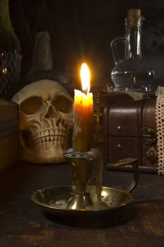 Gothic still life with a skull and a candle