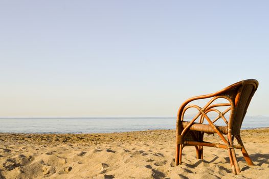 Wicker chair on Amoudara beach in Crete