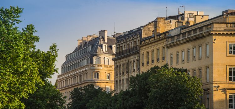 Typical Bordeaux architecture in the centre of Bordeaux, France. Decorative appartment building on spring day.