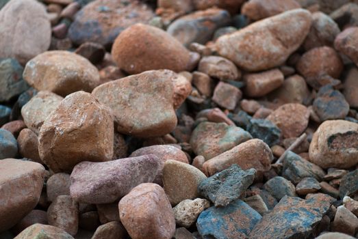 pile of stones near sea bank background texture.