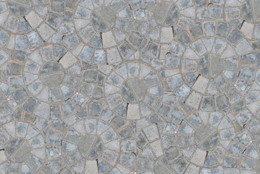 Cobble circular pattern block pavement texture background. Top view.