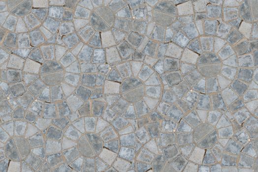 Cobble circular pattern block pavement texture background. Top view.