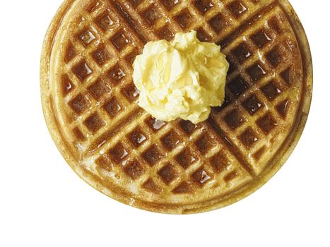 close up of traditional classic belgium american waffle with butter and maple syrup