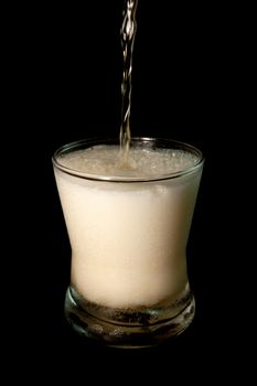 Beer in glass isolated on black background. Pour beer. objects with clipping paths.