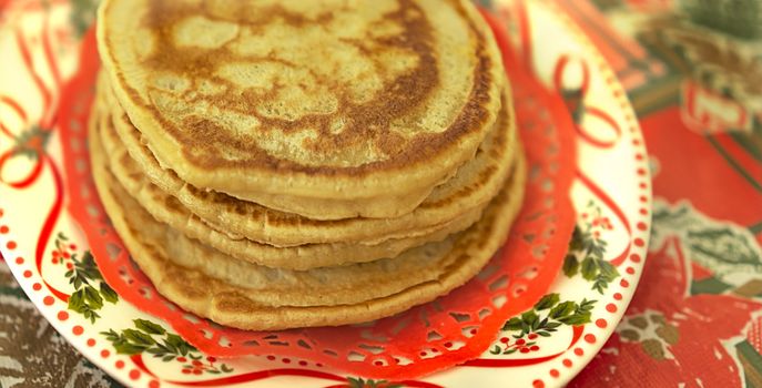 Plate of traditional fresh homemade hot pancakes for christmas breakfast