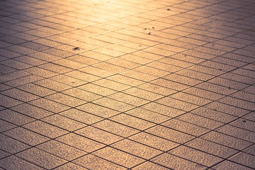 Selective focus tile roads and the rays of the setting sun