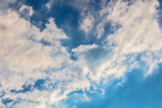 Abstract background, blue sky with clouds close-up