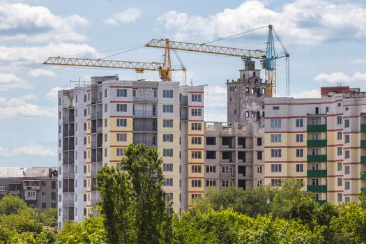 Industrial landscape, construction of high-rise buildings and cranes