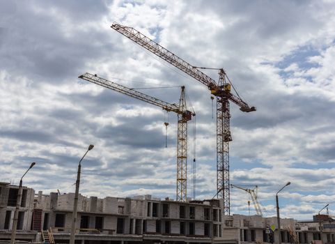 Industrial landscape, construction of high-rise buildings and cranes