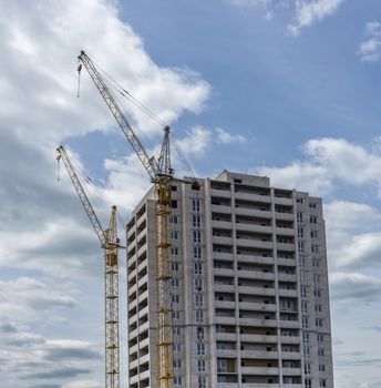 Industrial landscape, construction of high-rise buildings and cranes