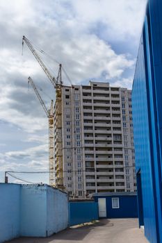 Industrial landscape, construction of high-rise buildings and cranes