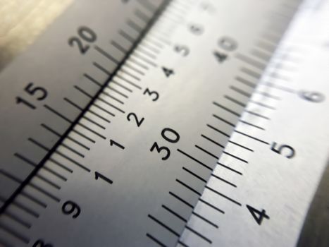 Macro shot of a vernier caliper reading in millimeters.