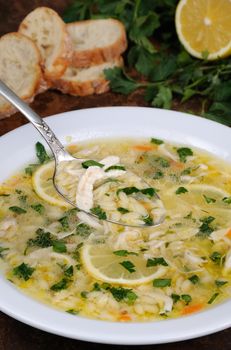 Avgolemono, greek   chicken soup with egg-lemon sauce, orzo and fresh parsley leaves