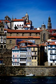 Cityscape of Old Town Porto with Traditional Portuguese Houses and View of Clerigos Tower against Blue Sky Outdoors