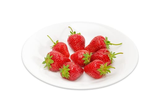 Several ripe fresh garden strawberry fruits on the white dish on light background
