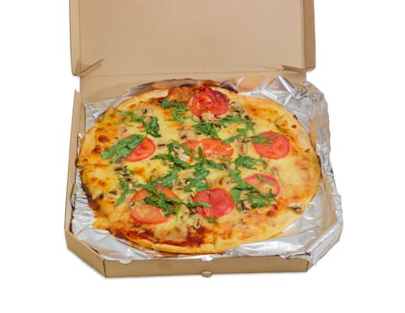 Cooked round pizza with tomatoes, mushrooms and arugula wrapped in aluminum foil in the open cardboard box on a light background
