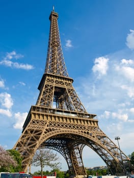 Bottom view of the Eiffel Tower against of the sky in springtime in Paris, France.
