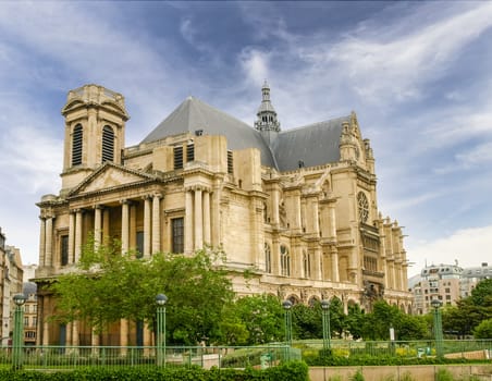 Western and southern facades of the Church of Saint-Eustache built in the 17th century in Gothic style with Renaissance elements in Paris, France
