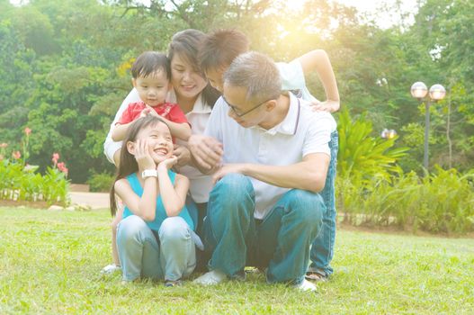 asian family having fun time at outdoor