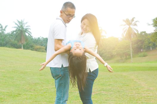 asian family having fun time at outdoor