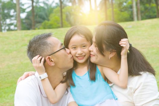 Outdoor portrait of asian family