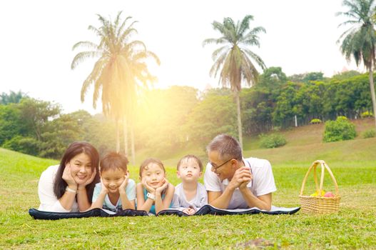 Outdoor portrait of asian family