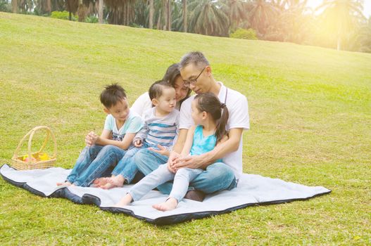 asian family having fun time at outdoor