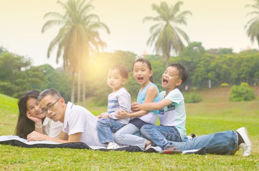 asian family having fun time at outdoor