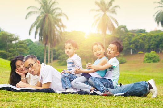 asian family having fun time at outdoor